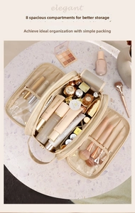 Internal compartments of large beige travel toiletry bag with makeup brush slots