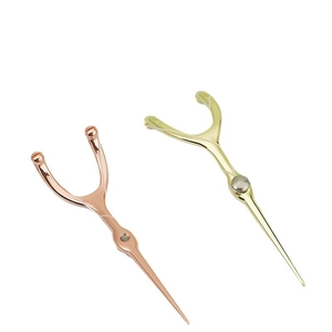 Portable stainless steel toothpicks in rose gold and gold finish for oral cleaning