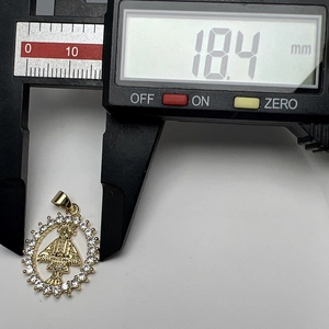 Macro view of Our Lady of Guadalupe gold pendant with cubic zirconia and 18.4mm measurement
