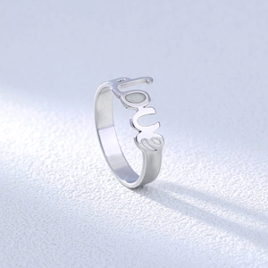 Macro shot of 304 stainless steel ring featuring a polished hollow Love letter design