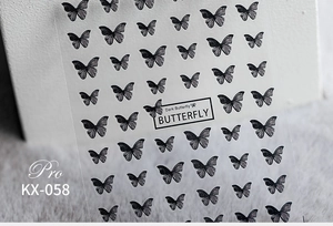 Detail shot of KX-058 dark butterfly 5D nail stickers on transparent film