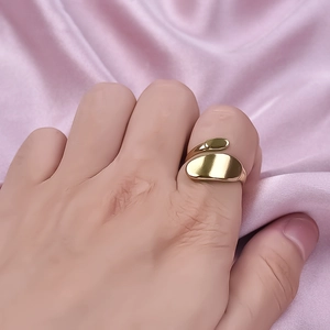 Adjustable 304 stainless steel gold ring with curved double oval design on pink satin