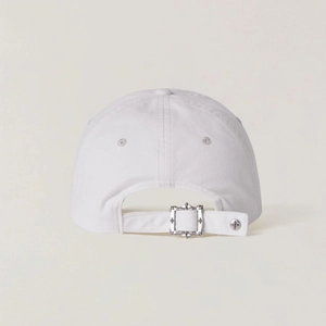 Detail of adjustable back strap on white cotton baseball cap with silver cross buckle