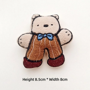 Detail of embroidered cartoon bear patch wearing overalls, size H 8.5cm x W 8cm