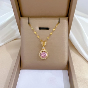 Pink round stone necklace with gold titanium steel chain and zircon inlay in a jewelry box