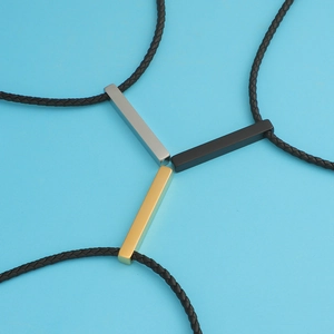 Three rectangular 3D bar pendants in silver black and gold with black braided leather cords