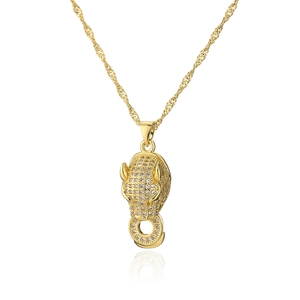 Detailed view of leopard head pendant with sparkling zircons on gold twisted rope chain