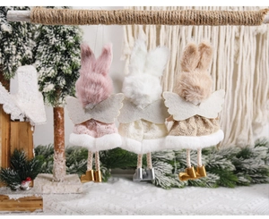 Detailed view of three plush angel bunny ornaments with lace skirts and felt wings
