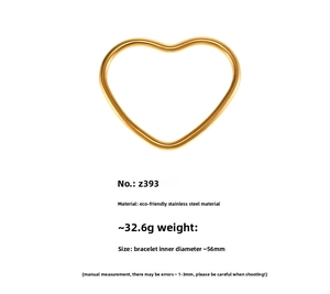 Detail view of gold heart bangle in polished stainless steel with 56mm inner diameter