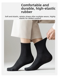 Detail of high-elasticity black cotton crew sock featuring a classic ribbed texture