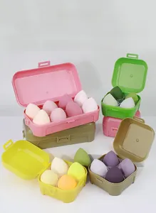 Set of soft makeup sponges in various shapes and colors packed in egg-style storage boxes