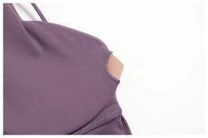 Detail of purple sports bra with removable pads and smooth flatlock stitching