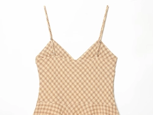 Detail of V-neck plaid camisole dress with adjustable straps and check pattern