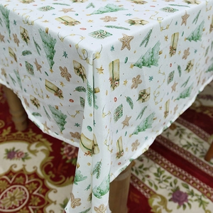 Christmas themed waterproof rectangular tablecloth with festive trees and gingerbread prints