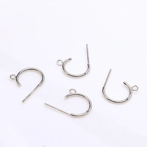 Detailed view of silver C-shaped earring posts with loop and S925 hallmark for DIY jewelry
