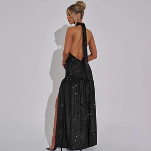 Close-up of elegant black sequin halter neck dress with backless design and high side slit