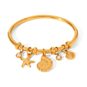 Gold stainless steel ocean charm bracelet with starfish, seashell, and zircon accents
