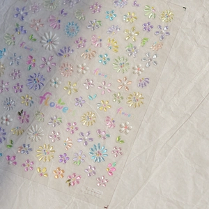 Detailed view of 3D embossed macaron flower nail art stickers with glossy resin texture