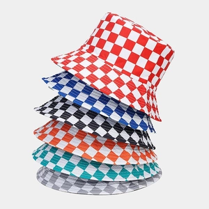 Detailed stack of multi-colored checkerboard bucket hats showing fabric texture and patterns