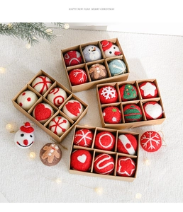 Detail of Christmas wool felt ornaments with snowflakes and trees in a gift box