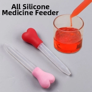 Close-up of heart-shaped silicone medicine feeder for babies with clear scale markings