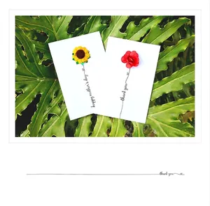 Detail of 3D fabric flower greeting cards with sunflower and rose on green leaves