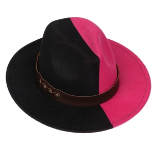 Detail of black and fuchsia wool fedora hat with brown studded leather band