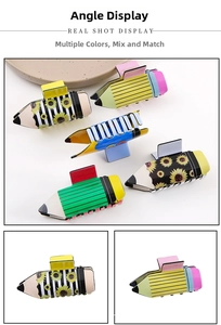 Detail showing various patterns and colors of pencil-shaped hair claw clips for women