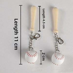Macro shot of baseball keychain showing 11cm length, wooden bat and mini leather ball