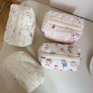 Quilted cotton cosmetic bags in cute floral and cartoon patterns with zipper closure