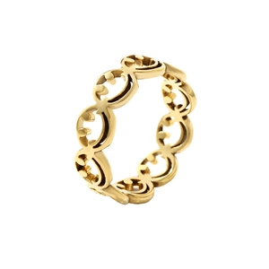 Polished golden stainless steel ring featuring unique laser-cut smiley face patterns