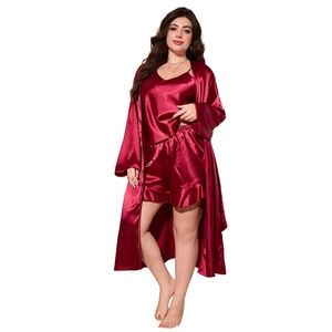 Three-piece burgundy satin pajama set for women including camisole, shorts and robe