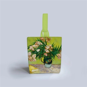 Detail of Van Gogh painting print on a light green handled canvas bucket handbag