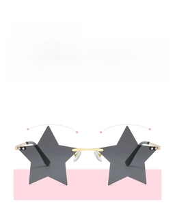 Detail of star-shaped rimless sunglasses with grey lenses and lightweight gold bridge