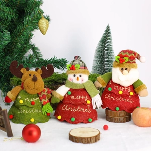 Macro detail of Christmas plush figurines featuring Santa, Snowman, and Reindeer themes