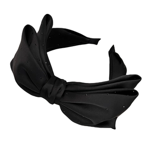 Elegant black oversized silk bow headband with subtle polka dots and wide frame for women