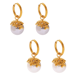 Golden flower hoop earrings with white pearls on a clean white background