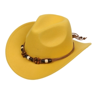 Detail of yellow cowboy hat featuring a braided band with dark brown and light beads