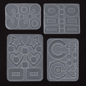 Set of four translucent silicone molds for DIY resin jewelry featuring star and heart shapes