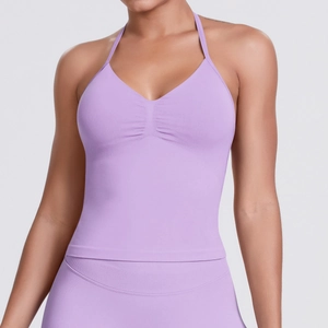 Detail of lavender seamless ribbed sports bra with halter neck and ruching detail