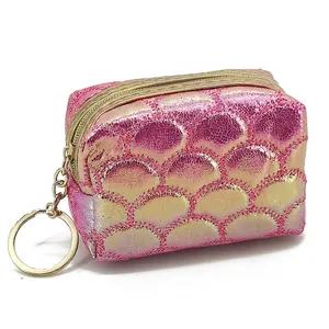 Mini iridescent fish scale coin purse with gold zipper and keyring on white background