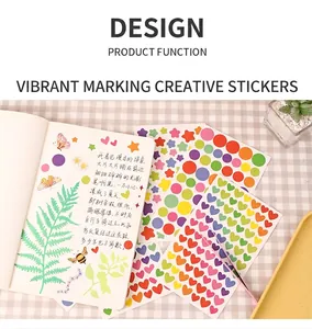 Close-up of colorful heart and star stickers applied to a creative DIY planner book