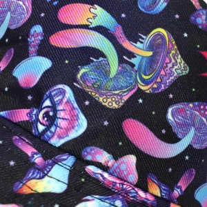 Macro detail of high-density canvas fabric featuring psychedelic mushroom prints for bucket hats