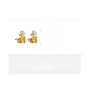 Detailed specs of artistic wavy gold and pearl earrings with 2.4cm by 2cm dimensions