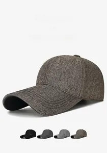 Detail showing extended brim for sun protection and metal mountain logo on baseball cap