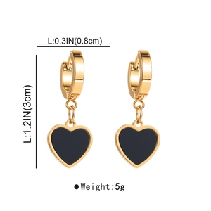 Detail shot of gold heart earrings with black enamel finish and size dimensions