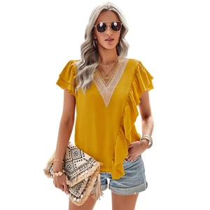 Women's yellow V-neck short sleeve shirt with ruffle sleeves and lace details on white background