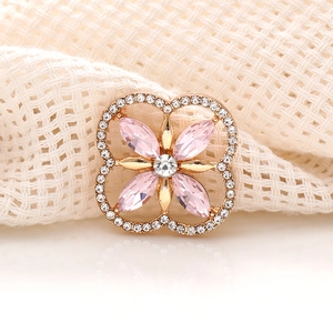 Pink marquise crystal clover charm in gold setting with sparkling rhinestone border