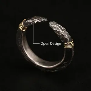 Retro hammered silver spearhead ring with golden wire wrap and intricate scroll engraving