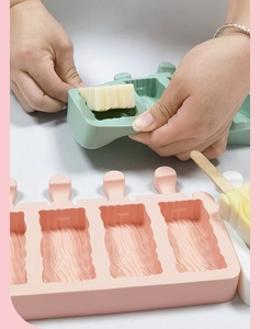 Close-up of flexible silicone ice cream mold demonstrating easy release of wavy popsicles